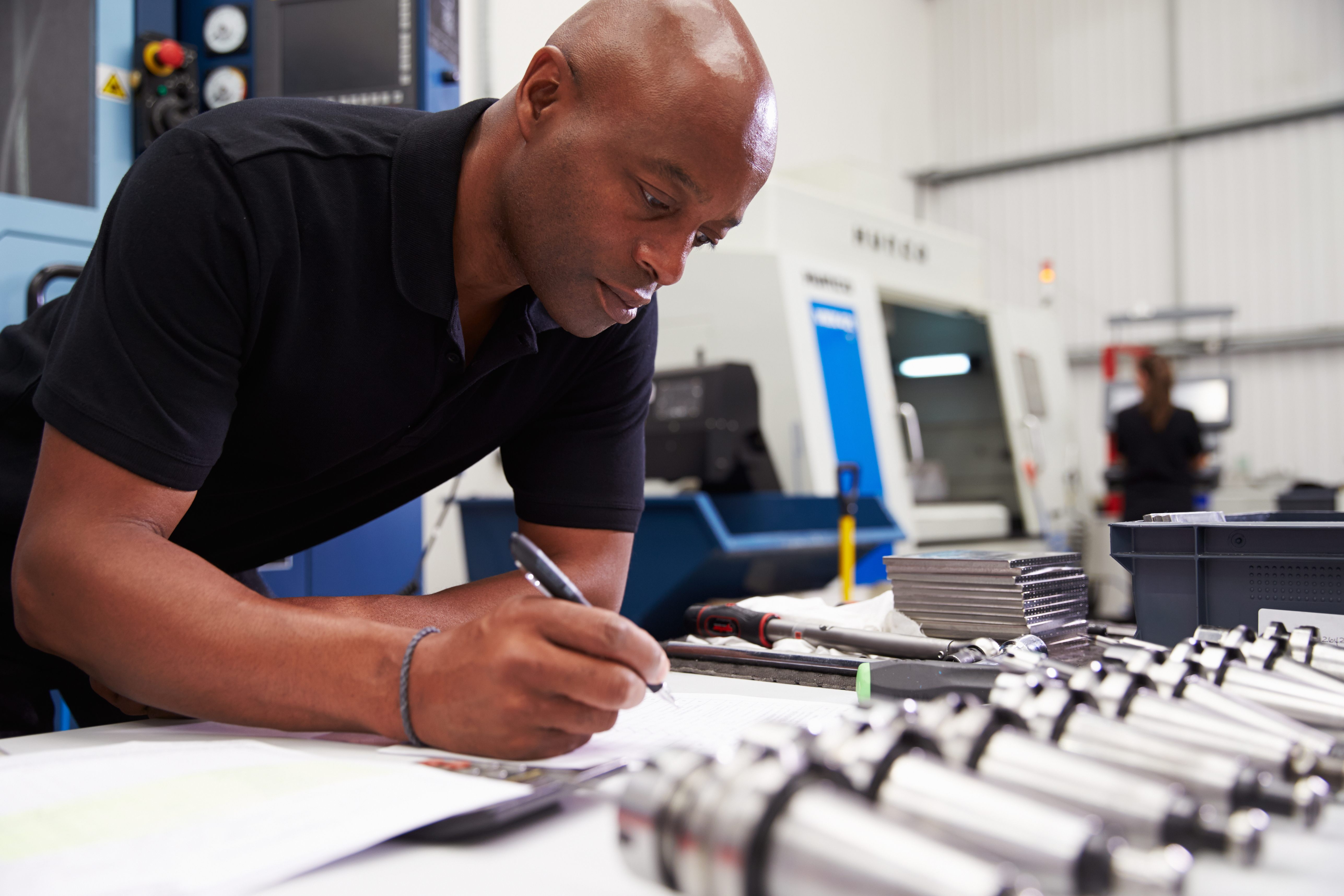 Photograph of man and machinery